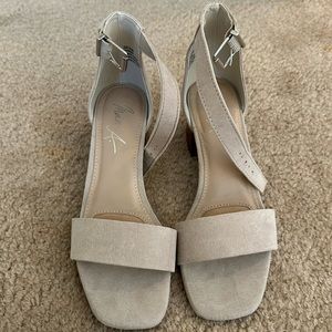 Neutral block heel sandals.